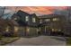 Inviting two-story home featuring a three-car garage and a cozy front porch at 22386 E Arbor Pl, Aurora, CO 80016