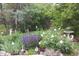 Backyard garden featuring blooming flowers and bird bath at 22386 E Arbor Pl, Aurora, CO 80016