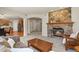 Spacious living room featuring a stone fireplace, and open floor plan at 22386 E Arbor Pl, Aurora, CO 80016