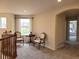 Upstairs loft area with comfortable seating near window, bright light, and carpeted floors at 22386 E Arbor Pl, Aurora, CO 80016