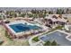 Aerial view of community pool with multiple covered lounging areas and mature landscaping at 22386 E Arbor Pl, Aurora, CO 80016