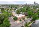 Aerial view showcasing the building's roof, surrounding trees, and urban skyline in the distance at 2862 Champa St, Denver, CO 80205