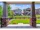 Backyard view from covered patio showing neighboring home at 22656 E Glidden Dr, Aurora, CO 80016