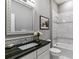Bright bathroom with a white vanity, granite countertops, and a shower-tub combination with decorative tile at 22656 E Glidden Dr, Aurora, CO 80016
