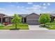 Charming single Gathering home with manicured front lawn and two car garage at 22656 E Glidden Dr, Aurora, CO 80016