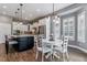 Gourmet kitchen with white cabinets and views to a breakfast nook at 22656 E Glidden Dr, Aurora, CO 80016