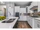 Beautiful kitchen with white cabinets, stainless appliances and center island at 22656 E Glidden Dr, Aurora, CO 80016