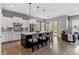Open kitchen featuring oversized island with pendant lights, and stainless appliances at 22656 E Glidden Dr, Aurora, CO 80016