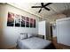 This bedroom features high ceilings, a ceiling fan, and minimalist decor to maximize the space at 2261 Blake St # 5H, Denver, CO 80205