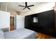 This bedroom features high ceilings, a ceiling fan, wood floors, and a wardrobe closet at 2261 Blake St # 5H, Denver, CO 80205
