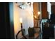 Unique lighting fixture and art decor in the hallway, with a view of the kitchen at 2261 Blake St # 5H, Denver, CO 80205