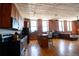 Open kitchen featuring wooden cabinetry, granite countertops, and island seating at 2261 Blake St # 5H, Denver, CO 80205