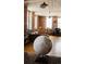 Charming living space featuring exposed brick, hardwood floors, and globe decor at 2261 Blake St # 5H, Denver, CO 80205