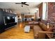 Spacious living room showing the hardwood floors, kitchen, and industrial-style lighting at 2261 Blake St # 5H, Denver, CO 80205