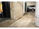 Parking garage space featuring a marked spot, elevator, and a view of parked cars at 2261 Blake St # 5H, Denver, CO 80205