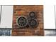 Steampunk style decorative clock on a brick wall near a window with a view at 2261 Blake St # 5H, Denver, CO 80205