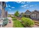 Well-manicured backyard featuring lush green grass and a charming split rail fence at 18926 W 94Th Ave, Arvada, CO 80007