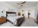 Bright primary bedroom with vaulted ceiling, ceiling fan, ensuite bath and large window at 18926 W 94Th Ave, Arvada, CO 80007