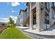 Home exterior with stone accents, stairway and manicured lawn, creating an inviting outdoor space at 18926 W 94Th Ave, Arvada, CO 80007