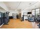 Modern fitness center with state-of-the-art equipment, weights, and a mirrored wall for a complete workout experience at 18926 W 94Th Ave, Arvada, CO 80007
