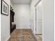 Hallway featuring coat rack, storage bench, and a large rug at 18926 W 94Th Ave, Arvada, CO 80007