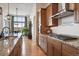 Contemporary kitchen with a center island, granite countertops, and stainless steel appliances at 18926 W 94Th Ave, Arvada, CO 80007