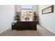 Home office space with a large desk and a window providing natural light at 18926 W 94Th Ave, Arvada, CO 80007
