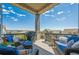 Outdoor patio with comfortable seating, barbecue, and scenic neighborhood views at 18926 W 94Th Ave, Arvada, CO 80007