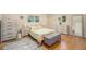 Inviting bedroom with ample natural light, hardwood floors, and neutral toned furniture at 90 Ammons St, Lakewood, CO 80226