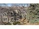 Aerial view of the townhomes featuring well-manicured lawns and mature trees at 1818 S Quebec Way # B15-5, Denver, CO 80231