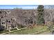 An aerial perspective highlighting the property's layout and landscape within a lush, green setting at 1818 S Quebec Way # B15-5, Denver, CO 80231