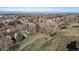 Overhead shot showing community homes nestled amongst trees, offering a serene and picturesque setting at 1818 S Quebec Way # B15-5, Denver, CO 80231