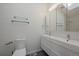 Modern bathroom featuring a double sink vanity, stylish mirrors and lighting, plus a separate toilet at 1818 S Quebec Way # B15-5, Denver, CO 80231