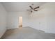 Neutral bedroom with ceiling fan, vaulted ceiling, and easy access to the en-suite bathroom at 1818 S Quebec Way # B15-5, Denver, CO 80231