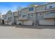 Multi-level townhome showcasing private balconies and individual garages, with plenty of parking at 1818 S Quebec Way # B15-5, Denver, CO 80231