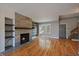 Inviting living room featuring a fireplace with tile surround and hardwood floors at 1818 S Quebec Way # B15-5, Denver, CO 80231