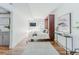 Bright bedroom featuring a Murphy bed, modern decor, hardwood floors, and natural light at 1835 Columbine Ave, Boulder, CO 80302