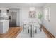 Bright and airy dining area with stainless appliances and modern table set for six at 1835 Columbine Ave, Boulder, CO 80302