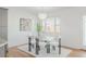 A well lit, cozy dining area featuring modern lighting and white and glass furniture at 1835 Columbine Ave, Boulder, CO 80302