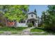 Charming two-story home featuring a welcoming front porch, well-maintained lawn, and attractive stone pathway to the front door at 1835 Columbine Ave, Boulder, CO 80302