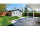 Detached garage with well-manicured lawn and stone pathway; perfect for storage or workshop space at 1835 Columbine Ave, Boulder, CO 80302