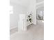 Upstairs hallway featuring fresh paint and carpet, and a built-in bookcase for storage and display at 1835 Columbine Ave, Boulder, CO 80302