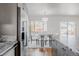 Granite countertops and stainless steel appliances accent this open concept kitchen and dining area at 1835 Columbine Ave, Boulder, CO 80302