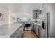 Well-equipped kitchen with granite countertops, stainless steel appliances, and a central island with bar seating at 1835 Columbine Ave, Boulder, CO 80302