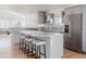 Modern kitchen with granite countertops, stainless steel appliances, an island with seating, and hardwood floors at 1835 Columbine Ave, Boulder, CO 80302