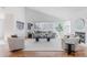 Bright, modern living room with high ceilings, large windows, hardwood floors, and a cozy fireplace at 1835 Columbine Ave, Boulder, CO 80302