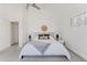 Bright bedroom with a plush rug, neutral-toned walls, large windows, and a comfy bed with throw pillows at 1835 Columbine Ave, Boulder, CO 80302