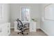 Bright office space with modern white desk, perfect for working from home with a large window at 1835 Columbine Ave, Boulder, CO 80302