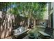 Charming backyard patio with stylish furniture, grill, and privacy fence at 2103 W 32Nd Ave # 10, Denver, CO 80211