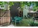 Private backyard patio with seating, string lights, and access to the home at 2103 W 32Nd Ave # 10, Denver, CO 80211